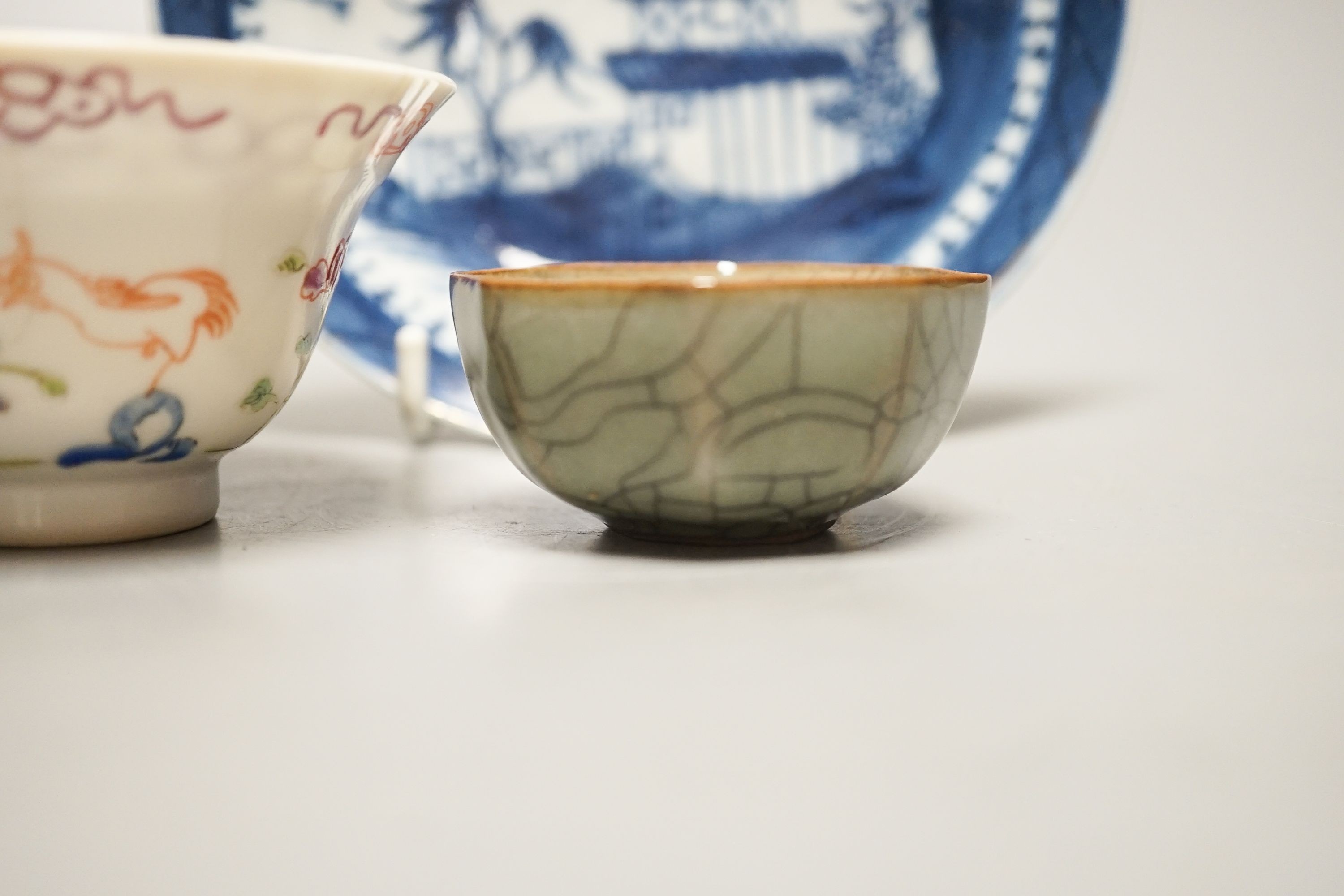 A Chinese Imari tea bowl and saucer, a famille rose tea bowl, a saucer and a celadon glazed cup